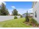 Spacious backyard featuring a well-maintained lawn and a white fence at 4017 W Fig St, Tampa, FL 33609
