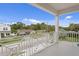 Balcony view with white railings and surrounding neighborhood at 4017 W Fig St, Tampa, FL 33609