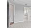Bedroom leading to ensuite bath featuring marble floors, walk-in shower, and tub at 4017 W Fig St, Tampa, FL 33609