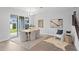Dining room featuring a modern table with views of the backyard through sliding glass doors at 4017 W Fig St, Tampa, FL 33609
