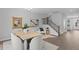 Dining room showcasing a table set for six, complemented by modern decor and staircase in the background at 4017 W Fig St, Tampa, FL 33609