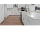 Modern kitchen with stainless steel appliances, stone countertops, and ample storage at 4017 W Fig St, Tampa, FL 33609