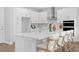Modern kitchen featuring a central island with bar stool seating and stainless steel appliances at 4017 W Fig St, Tampa, FL 33609
