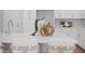 Modern kitchen island with sleek countertops, stylish bar stools, and elegant decor accents at 4017 W Fig St, Tampa, FL 33609