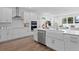 Modern kitchen with stainless steel appliances, island sink, and an open concept to the living room at 4017 W Fig St, Tampa, FL 33609