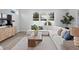 Sun-filled living room featuring a sectional sofa, stylish decor, and bright natural light at 4017 W Fig St, Tampa, FL 33609
