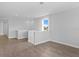 Upstairs living area with light walls, wood-look flooring, and lots of natural light at 4017 W Fig St, Tampa, FL 33609