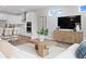 Bright, open-concept living room with modern furnishings and views into the kitchen at 4017 W Fig St, Tampa, FL 33609