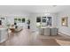 Open-concept living space with dining room, living room, and access to the outdoor patio at 4017 W Fig St, Tampa, FL 33609
