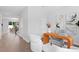 Open office area with modern desk, stylish chairs, and hardwood flooring throughout the home at 4017 W Fig St, Tampa, FL 33609