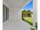 Covered patio with sliding glass doors overlooking the landscaped backyard at 4017 W Fig St, Tampa, FL 33609