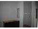 Bathroom with white tiled shower stall and a dark vanity at 707 W Fribley St, Tampa, FL 33603