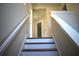 Wooden staircase leading to the upper level, showcasing the home's interior design at 7615 S Swoope St, Tampa, FL 33616