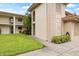 Condo building showcasing manicured lawn and building signage at 19029 Us Highway 19 N # 4-5, Clearwater, FL 33764