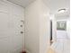 White door entrance to condo with view into living area at 19029 Us Highway 19 N # 4-5, Clearwater, FL 33764