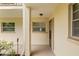 Condo entry with screen door and small window at 19029 Us Highway 19 N # 4-5, Clearwater, FL 33764