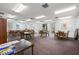 Community room with tables and chairs, ideal for gatherings at 19029 Us Highway 19 N # 4-5, Clearwater, FL 33764