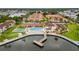 Aerial view of community, pool, and waterfront at 19029 Us Highway 19 N # 4-5, Clearwater, FL 33764