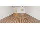 Spacious living area with wood-look floors and a ceiling fan at 19029 Us Highway 19 N # 4-5, Clearwater, FL 33764