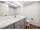 Bathroom with gray vanity, quartz countertop, and toilet at 19029 Us Highway 19 N # 4-5, Clearwater, FL 33764
