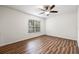 Bedroom with wood-look floors and a ceiling fan at 19029 Us Highway 19 N # 4-5, Clearwater, FL 33764