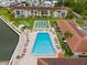 Aerial view showing pool, shuffleboard, and location at 19029 Us Highway 19 N # 4-5, Clearwater, FL 33764