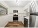 Modern white kitchen with stainless steel appliances at 19029 Us Highway 19 N # 4-5, Clearwater, FL 33764