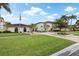 Community clubhouse with landscaping and flag at 19029 Us Highway 19 N # 4-5, Clearwater, FL 33764