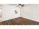 Spacious living area featuring wood-look floors and a ceiling fan at 19029 Us Highway 19 N # 4-5, Clearwater, FL 33764