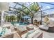 Relaxing screened pool and patio with comfortable seating and grill at 11116 Hoffner Edge Dr, Riverview, FL 33579