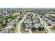 Aerial view of a residential neighborhood with houses, lush greenery, and a golf course at 11116 Hoffner Edge Dr, Riverview, FL 33579