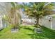 The side yard has two large planters and a paved patio area at 11116 Hoffner Edge Dr, Riverview, FL 33579