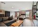 Open concept bedroom with a sitting area and exposed brick wall at 11116 Hoffner Edge Dr, Riverview, FL 33579