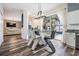 Kitchen dining area with glass table and modern chairs, pool view at 11116 Hoffner Edge Dr, Riverview, FL 33579