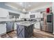 Modern kitchen with stainless steel appliances and large island at 11116 Hoffner Edge Dr, Riverview, FL 33579