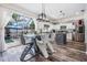Modern glass dining table with stylish chairs near kitchen and pool at 11116 Hoffner Edge Dr, Riverview, FL 33579