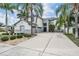 Two-story house with a driveway and landscaping at 11116 Hoffner Edge Dr, Riverview, FL 33579