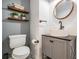 Modern bathroom with floating vanity and stylish fixtures at 11116 Hoffner Edge Dr, Riverview, FL 33579