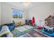 bedroom with playful decor, including toys and a play mat at 11116 Hoffner Edge Dr, Riverview, FL 33579