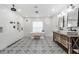 Spa-like bathroom with a freestanding tub, walk-in shower, and stylish tile at 11116 Hoffner Edge Dr, Riverview, FL 33579