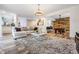 Open concept living room with a cozy sectional sofa and large rug at 11116 Hoffner Edge Dr, Riverview, FL 33579