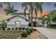 Two-story home with landscaping and driveway at 11116 Hoffner Edge Dr, Riverview, FL 33579