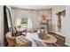 Cozy sitting area with two armchairs and a rustic accent wall at 11116 Hoffner Edge Dr, Riverview, FL 33579