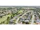 Aerial view showing neighborhood homes, landscaping, and a golf course at 11116 Hoffner Edge Dr, Riverview, FL 33579