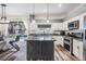 Modern kitchen featuring granite countertops, stainless steel appliances, and an island at 11116 Hoffner Edge Dr, Riverview, FL 33579
