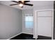 Bedroom with ceiling fan, window, and built-in closet at 12034 Stone Crossing Cir, Tampa, FL 33635