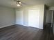 Large bedroom features two closets, a ceiling fan, and updated flooring at 1306 Idlewood Dr # 53, Sun City Center, FL 33573