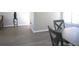 Dining area showcasing new flooring, a table set for four, and bright natural light at 1306 Idlewood Dr # 53, Sun City Center, FL 33573