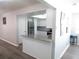 Bright kitchen features a granite breakfast bar and stainless steel appliances at 1306 Idlewood Dr # 53, Sun City Center, FL 33573