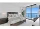 Bright bedroom with a king-size bed and stunning water views at 2912 W Santiago St # 1703, Tampa, FL 33629